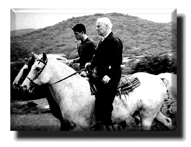 Picture of a young Al Gore on a riding horses with his father
