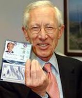 Stanley Fischer shows off his ID card